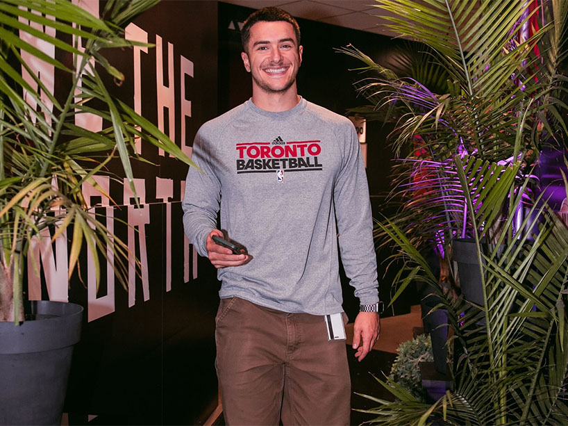 Émile Riga (Sport Media ‘22) smiles for the camera while behind the scenes at Scotiabank Arena.